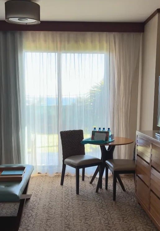 Ocean visible through the lānai slider of a first-floor Deluxe Studio at Kōloa Landing Resort, Poʻipū